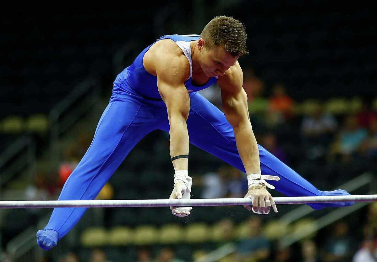 PITTSBURGH, PA - AUGUST 22: Jonathan Horton competes on the high bar in the senior men preliminaries during the 2014 P&G Gymnastics Championships at Consol Energy Center on August 22, 2014 in Pittsburgh, Pennsylvania. (Photo by Jared Wickerham/Getty Images)