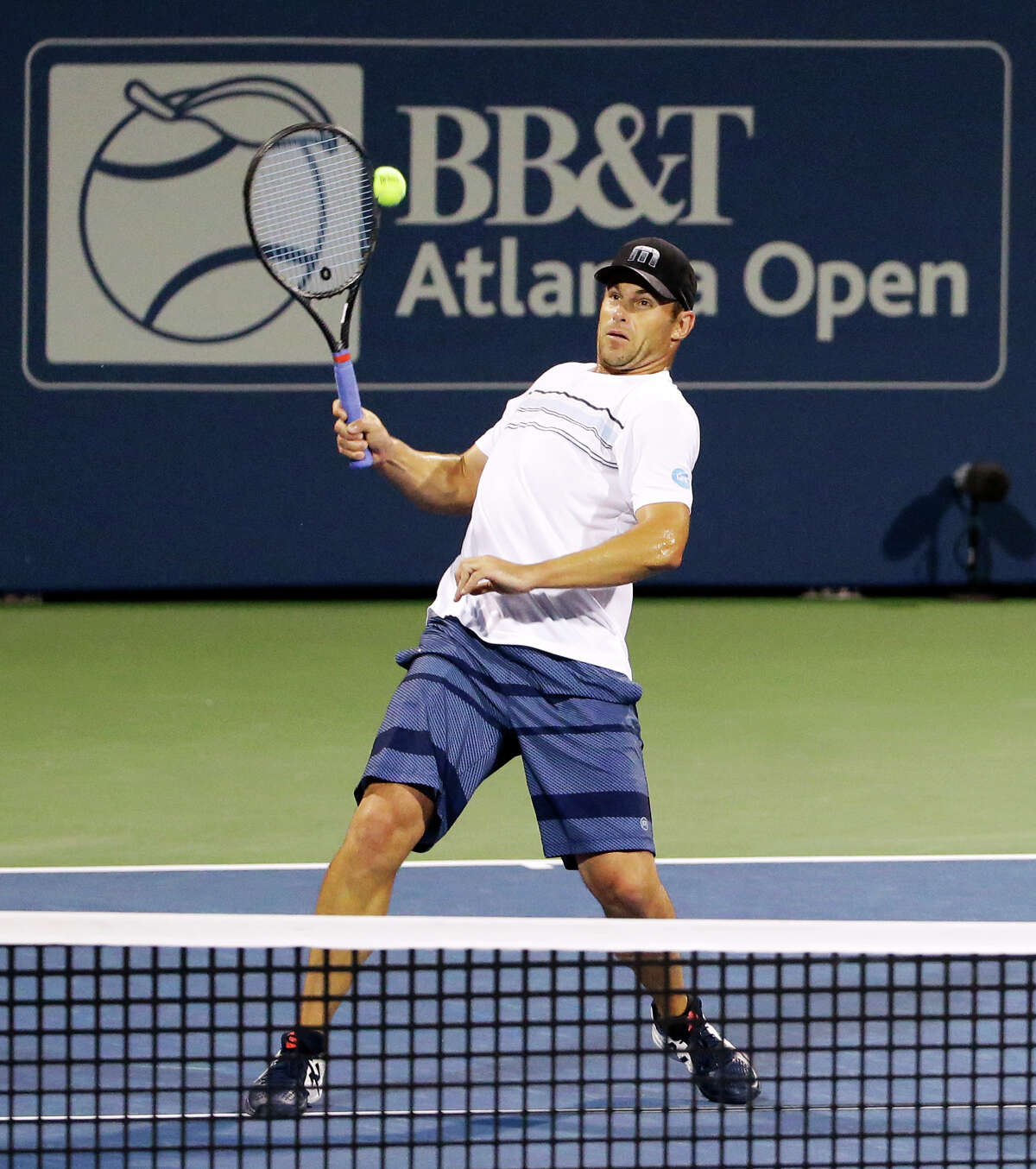 Andy Roddick returns a shot during the first set of a first round doubles match with partner Mardy Fish against Yen-Hsun Lu and Jonathan Marray at the Atlanta Open tennis tournament Wednesday, July 29, 2015, in Atlanta. Roddick and Fish won 7-6, 6-4. (AP Photo/David Goldman)