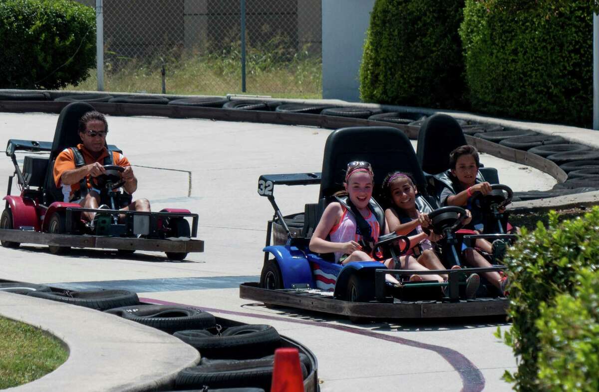 FILE - Riders enjoy the go karts at Malibu Grand Prix on Tuesday, Aug. 11, 2015 before the park closed for good.The 14-acre property will be used to consolidate multiple CPS Energy work sites into one.