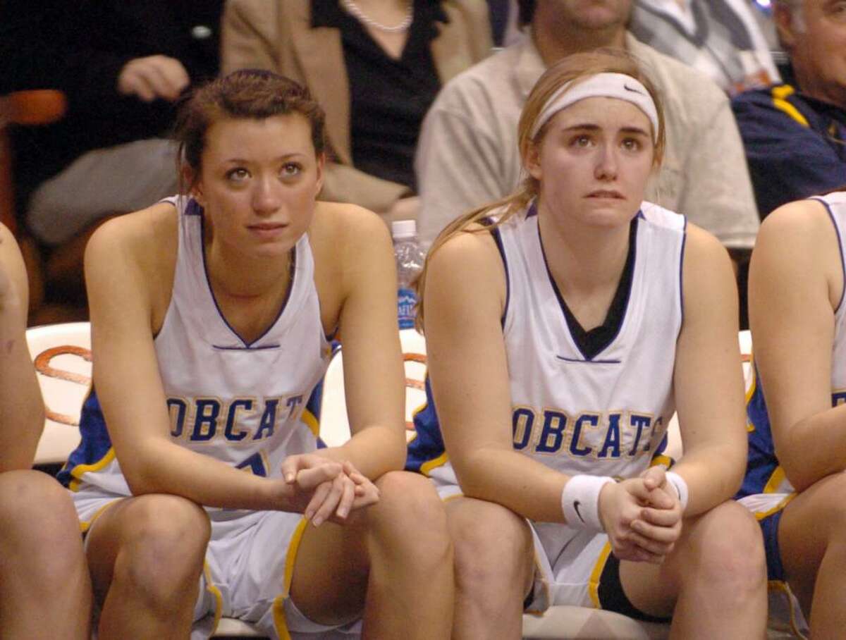 Brookfield 12, Jacklyn Brown and 20, Brittany Martelle, watch their teammates during the final moments of the championship girls basketball game against Kolby at Mohegan Sun, Friday, March 19, 2010.