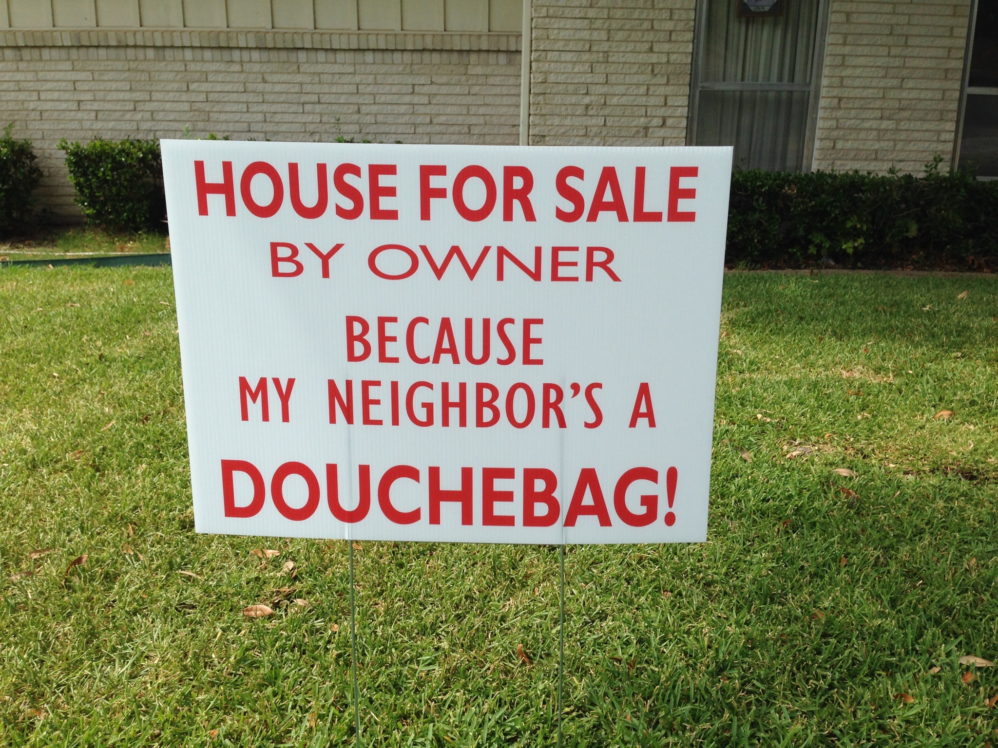 'House for sale by owner because my neighbor's a douchebag' sign raises