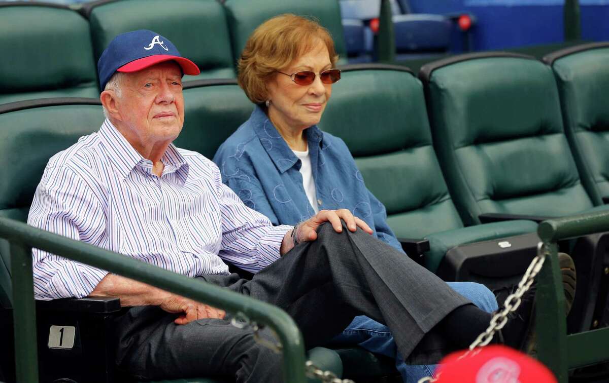 Former President Jimmy Carter and his wife, Rosalynn, wait for a baseball game between the Atlanta Braves and the San Diego Padres on Wednesday, June 10, 2015, in Atlanta.