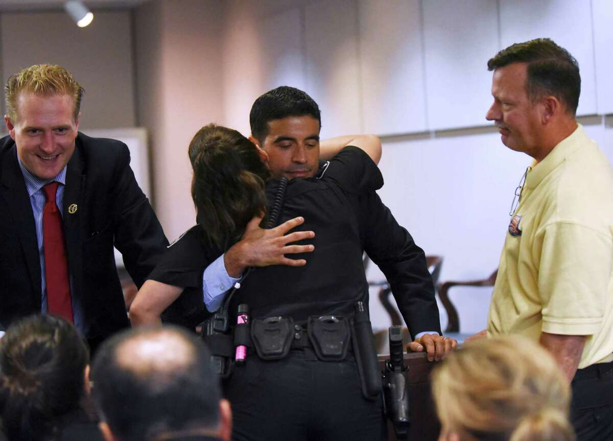 District attorney Nico LaHood embraces Selma Police Officer Tiffany Kierum, who was shot in the face by Jessie Hernandez Jr., after Hernandez was sentenced to life in prison in 437th State District Court on Friday, Aug. 14, 2015.
