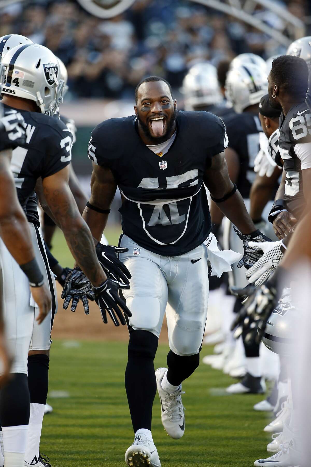 Running back Marcel Reece of the Oakland Raiders looks towards the News  Photo - Getty Images