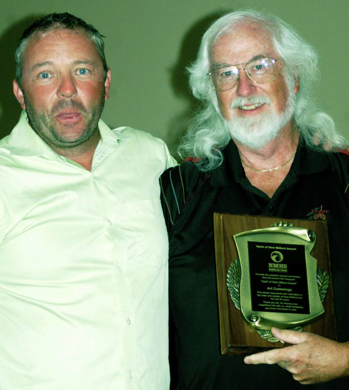Steve Byrne, left, director of the New Miilford High School Reunion Classic golf tournament, poses with Art Cummings, the event's inaugural “Spirit of New Milford” award recipient in tribute to his longtime community contributions.