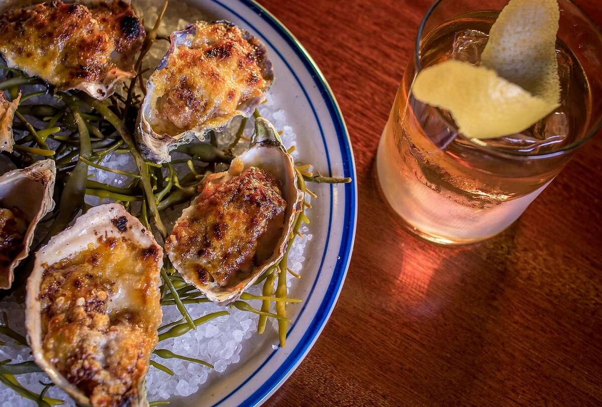 The broiled Oysters with the "Golden Era" cocktail at the Viking Room in San Francisco, Calif., are seen on August 14th, 2015.