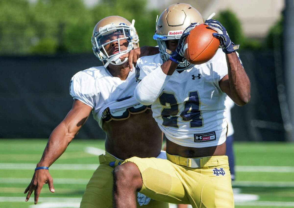 Notre Dame?’s KeiVarae Russell, left, and Nick Coleman participate in Notre Dame's NCAA college football practice Thursday, Aug. 13, 2015, in South Bend, Ind. (Robert Franklin/South Bend Tribune via AP)