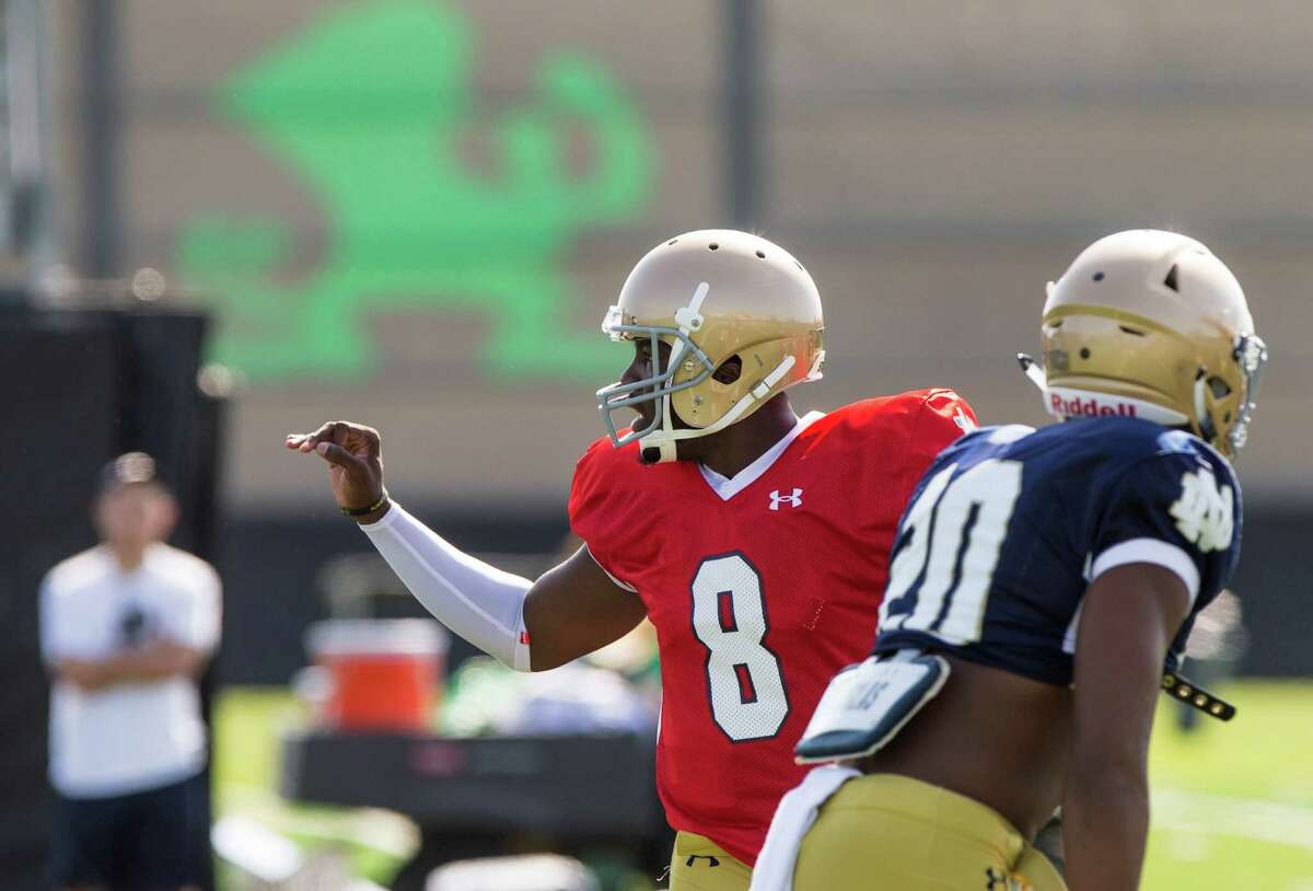 Notre Dame quarterback Malik Zaire (8) and a teammate take part practice on Aug. 13, 2015, in South Bend, Ind.