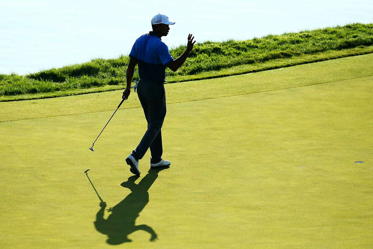 SHEBOYGAN, WI - AUGUST 15: Tiger Woods of the United States makes birdie on the 17th hole during the continuation of the weather-delayed second round of the 2015 PGA Championship at Whistling Straits on August 15, 2015 in Sheboygan, Wisconsin. (Photo by Richard Heathcote/Getty Images)