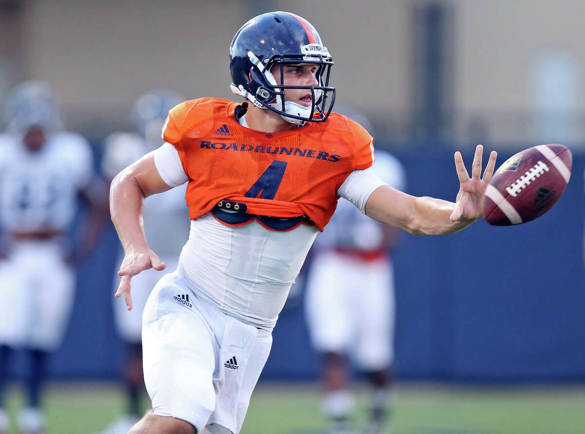 UTSA quarterback Blake Bogenschutz pitches the ball during practice held Friday Aug. 14, 2015 on campus.