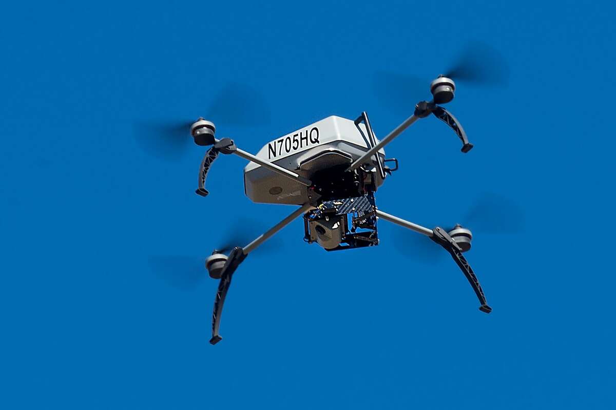 A drone operated by the Alameda County Sheriff's Office flies during a demonstration of a search and rescue operation on Friday, Aug. 14, 2015, in Dublin, Calif. As law enforcement joins the ranks of hobbyists sending drones into California skies, civil liberties advocates are raising the specter of unchecked police surveillance.