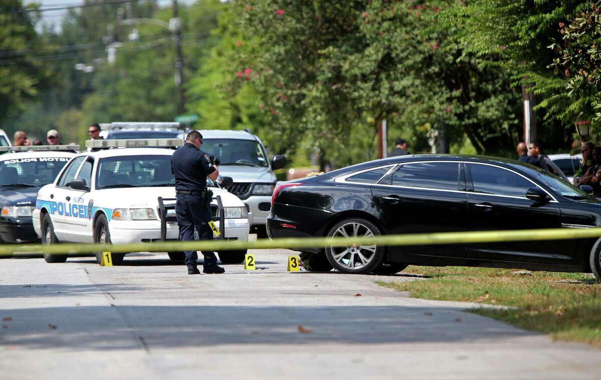 Houston Police Department investigates the scene of an officer involved shooting at 4204 Hoffman St. Monday, Aug. 17, 2015, in Houston, Texas. The suspect, a black male, was pronounced dead at the scene. Around 1 p.m. an officer responded to shots fired where there was a family disturbance at the residence.