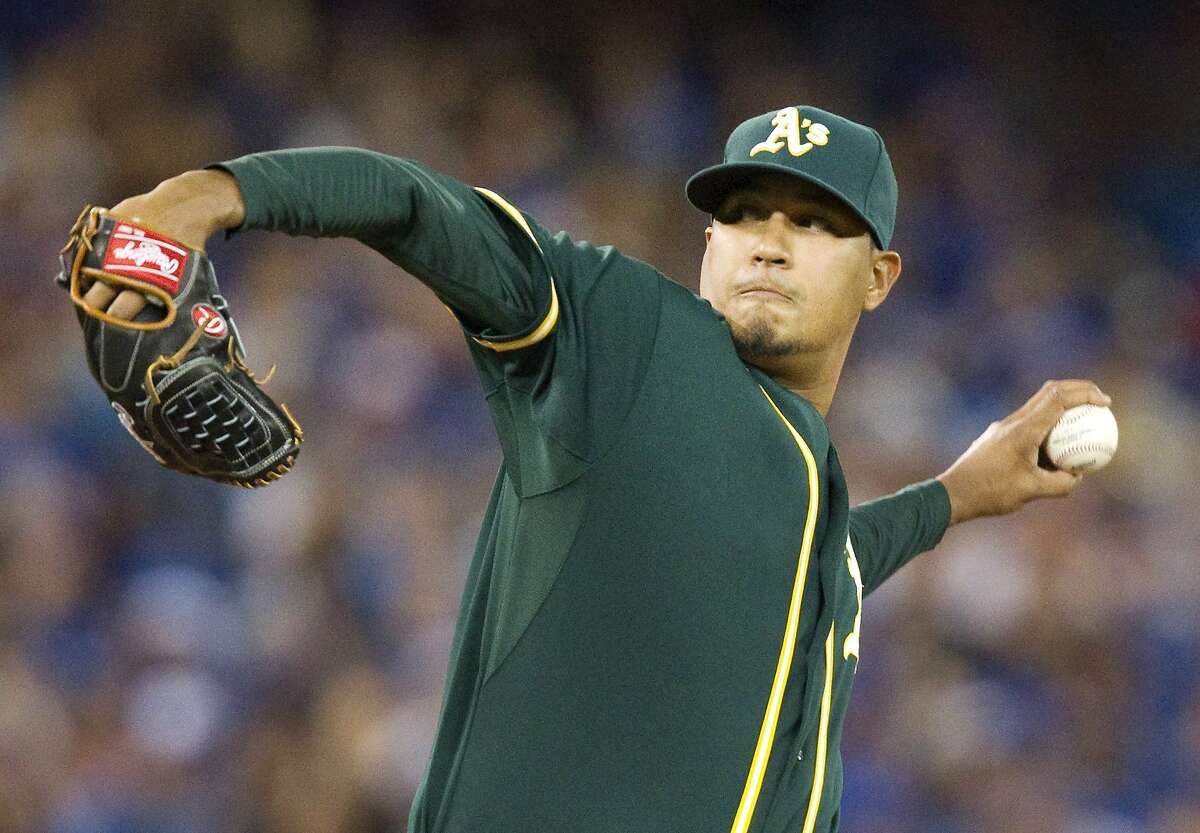 Oakland Athletics pitcher Felix Doubront throws against the Toronto Blue Jays during the fifth inning of a baseball game, Wednesday, Aug. 12, 2015, in Toronto. (Fred Thornhill/The Canadian Press via AP)
