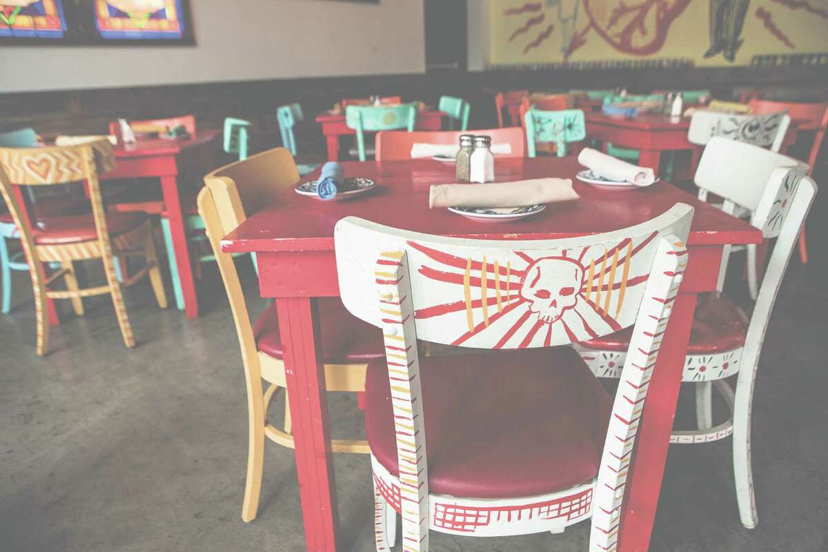 Custom-painted chairs adorned the interior of El Cantina Superior earlier this year. The restaurant has closed and will become a brewpub, its owners say. ﻿