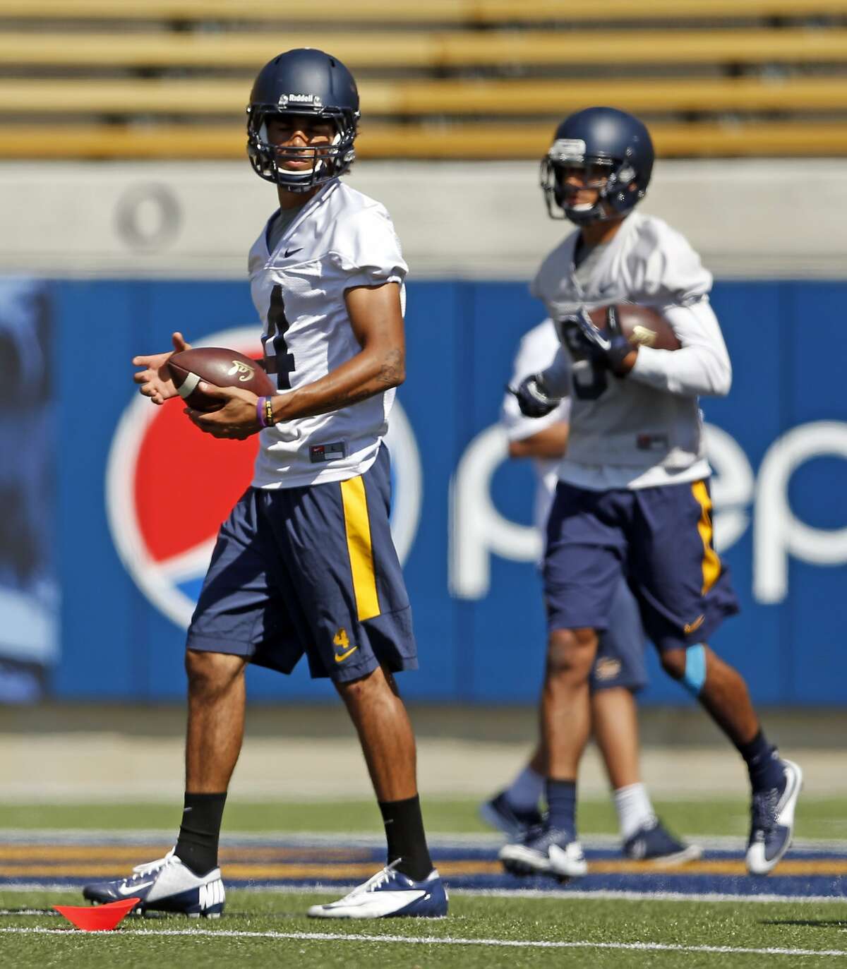 California's Kenny Lawler (left) and Trevor Davis during football practice in Berkeley, Calif., on Monday, Aug. 17, 2015.