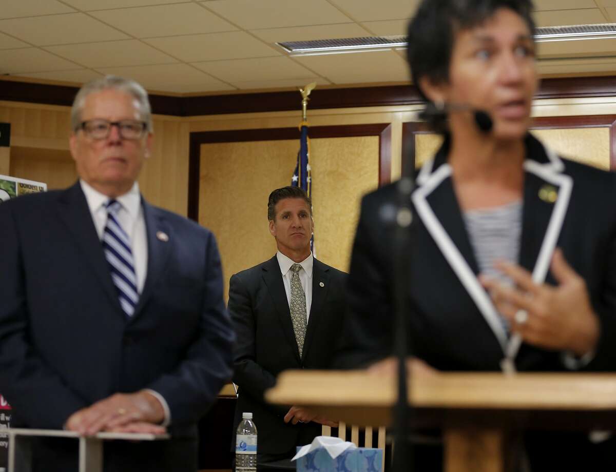 Dan Diaz, Brittany Maynard's husband, (center) and Senator Bill Monning, D-Carmel, listen to Assemblymember Susan Talamantes Eggman answer questions at a news conference on death-with-dignity legislation at the California State Capitol in Sacramento, California, on Tuesday, Aug. 18, 2015.