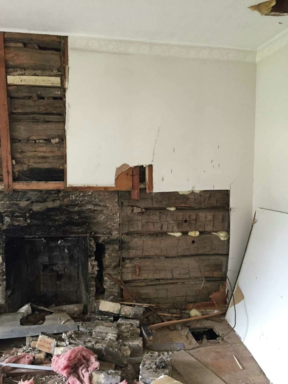 A land developer found a log cabin dating back to the 1860s while tearing out the walls of a home in Flower Mound he acquired as part of a land development plan.