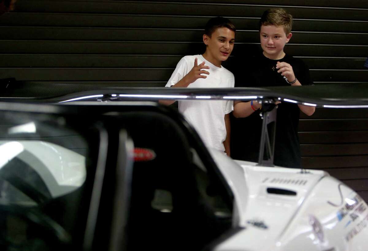 Chris Lerma, 15, and Brandon Bolitho, 14, along with 29 other incoming freshman, participated in the Build and Soar summer program, building a car unveiled to family and Lamar Consolidated officials on Tuesday.