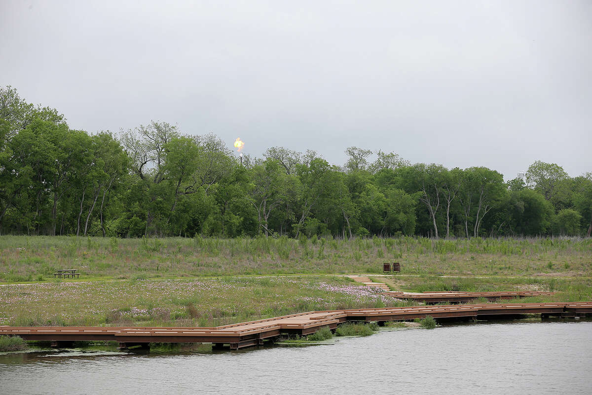 A flare from the Calumet Specialty Products Partners plant is seen from the Mission Reach of the San Antonio River in April 2014. It was fined nearly $30,000 for a jet fuel spill.