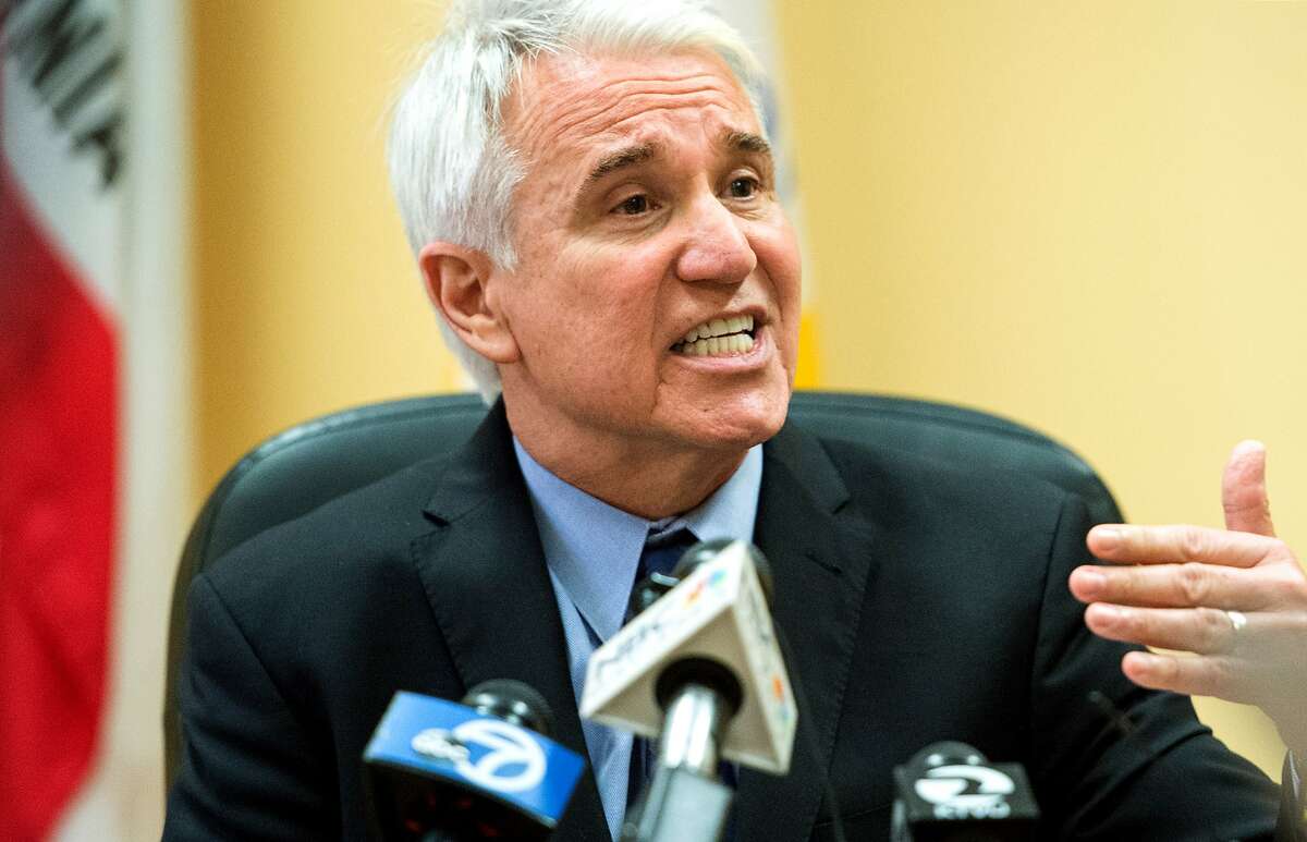 San Francisco District Attorney George Gascon speaks during a news conference at the Hall of Justice in San Francisco on Wednesday, Aug. 19, 2015. The district attorney's office announced that it is expanding a consumer-protection lawsuit aimed at ridesharing company Uber's claims about driver background checks. (AP Photo/Josh Edelson)