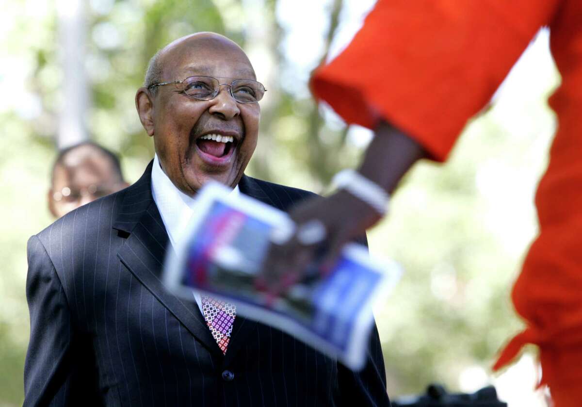 FILE - In this Thursday, Sept. 13, 2007, file photo, former U.S. Rep. Louis Stokes laughs as he is surprised to see Ohio Rep. Stephanie Tubbs Jones appear at the dedication ceremony for the new Louis Stokes Museum in Outhwaite Homes, in Cleveland. Stokes, a 15-term Ohio congressman who took on tough assignments looking into assassinations and scandals, died late Tuesday, Aug. 18, 2015. He was 90. (Thomas Ondrey/The Plain Dealer via AP, File) MANDATORY CREDIT; NO SALES