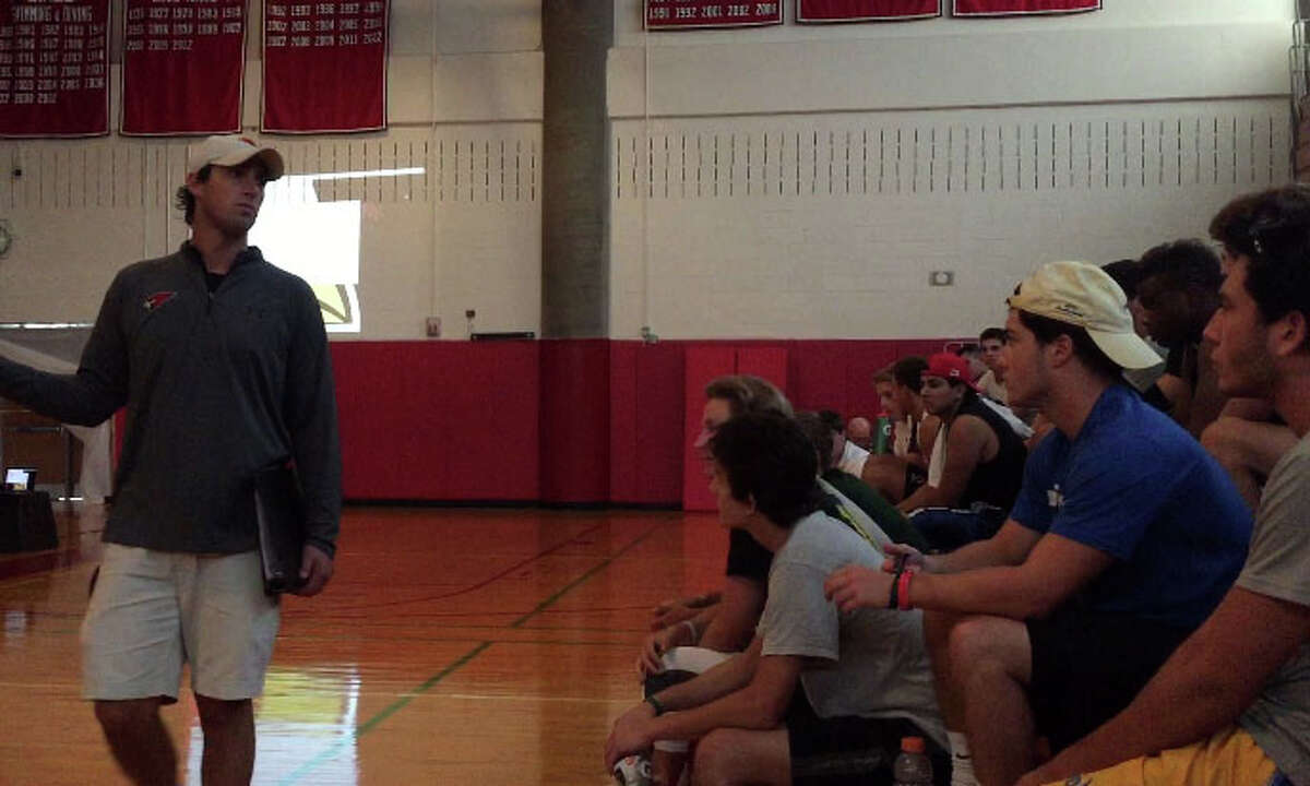 Greenwich High School head football coach John Marinelli addresses players during a YWCA presentation on domestic violence and sexual assault, in the high school’s gymnasium, on Wednesday, Aug. 19, 2015.