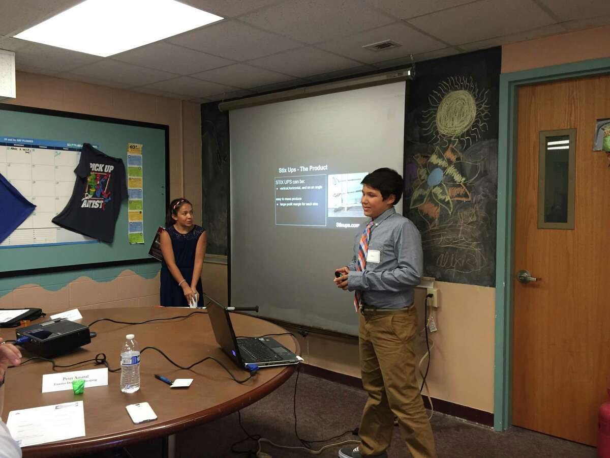 First-place winner Owen Palmer presenting his business plan at Pro Access, Bethel’s teen center, in August 2015.