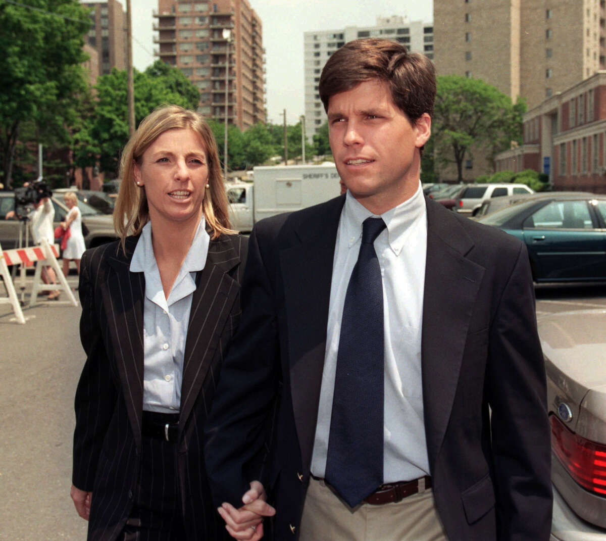 FILE - Alex Kelly walks with girlfriend Amy Molitor during a break for lunch at Stamford Superior Court in Stamford, Conn., Thursday, June 12, 1997. Kelly, 30, was convicted today in the 1986 rape of a Darien, Conn. high school student. (AP Photo/Richard Freeda)