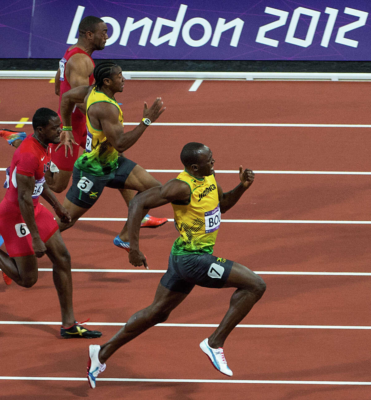 Usain Bolt of Jamaica, leads Justin Gatlin of the USA, Yohan Blake of Jamaica, and Tyson Gay of the USA down the track during the men's 100-meter final at the 2012 London Olympics on Sunday, Aug. 5, 2012. Bolt won gold in the event, with Blake second and Gatlin taking third. ( Smiley N. Pool / Houston Chronicle )