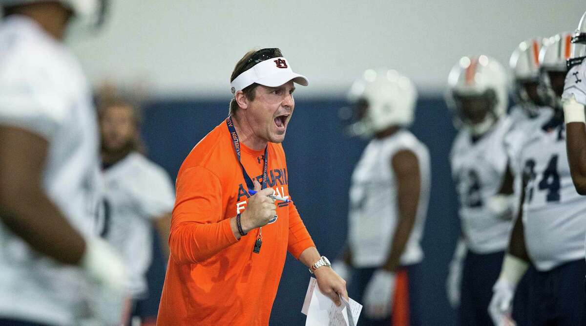 Auburn’s defensive coordinator Will Muschamp screams at a player during an NCAA college football practice in Auburn, Ala., on Aug. 4, 2015. There are 14 new coordinators around the league, including Muschamp at Auburn.
