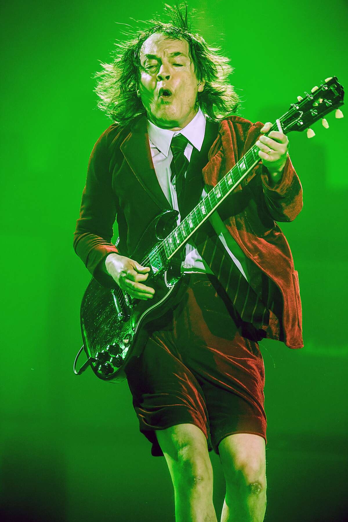 IMAGE DISTRIBUTED FOR PHILIPS - In this image released on Thursday, Aug. 20, 2015, lead-guitarist Angus Young of Australian band AC/DC performs during their 'Rock or Bust' tour. The band kick off the North American leg of the tour on Saturday in Foxborough, Massachusetts with a spectacular light show using technology from Philips, the global leader in lighting. The group's lighting designers Patrick Woodroffe and Cosmo Wilson pulled out all the stops to create a spectacle that would enthrall the 60,000-strong crowds attending AC/DC's 55 tour dates. The lighting provides more concentrated beams and generates less heat on stage which is welcomed by the performers. The cutting-edge technology allows the designers to create a multitude of lighting effects to complement every note of the band's hit-laden 150-minute set. Images and press release available at http://www.apassignments.com/multimedia-newsroom#philips-takes-acdc-back-out-of-the-black-with-explosive-light-show. (Ralph Larmann/Philips via AP Images)