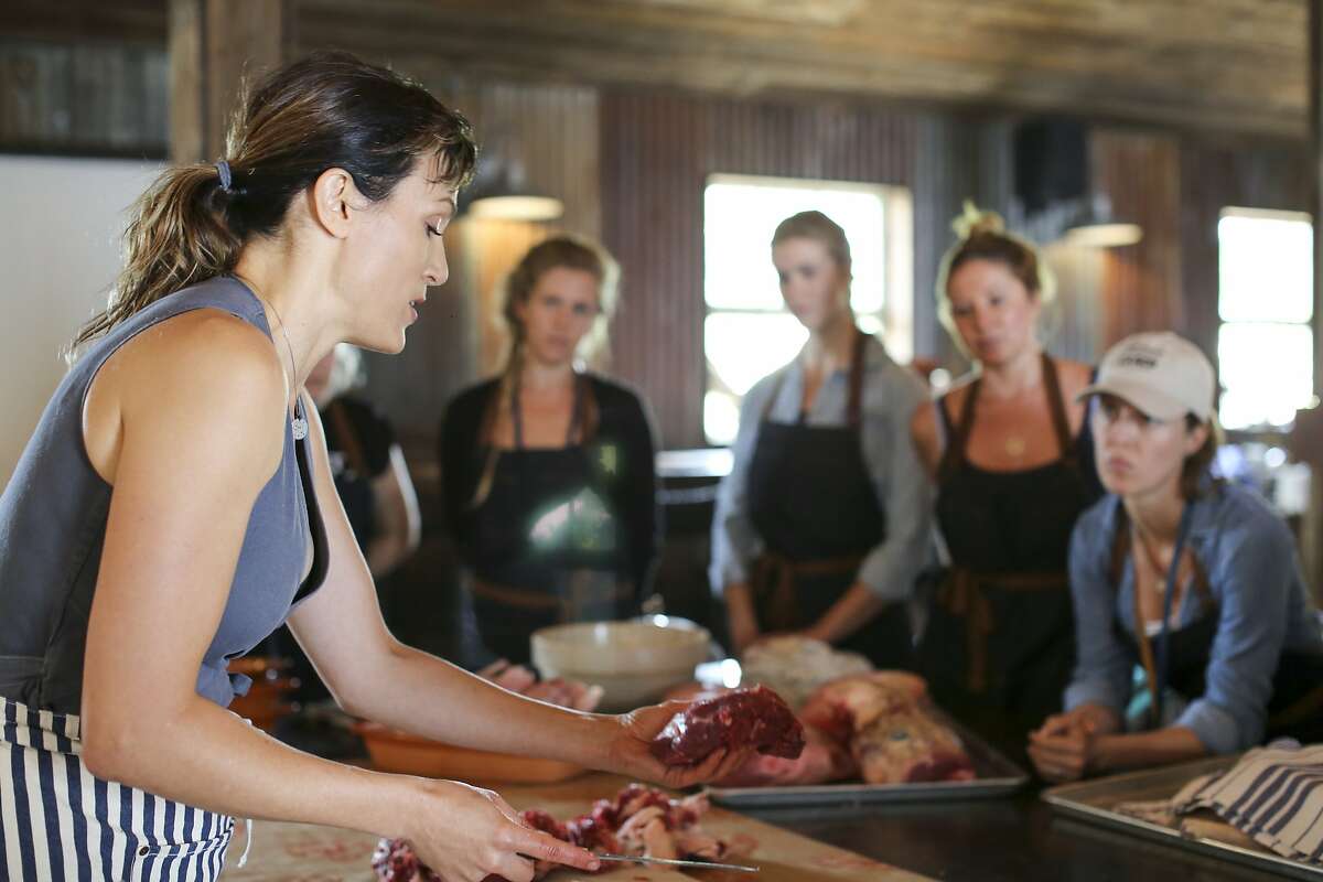 Rebecca Sullivan, Lindsey Ott, Analise Roland and Michelle Gaines watch as Belcampo CEO and co-founder, Anya Fernald, teaches a morning workshop at Belcampo?•s Meat Camp.