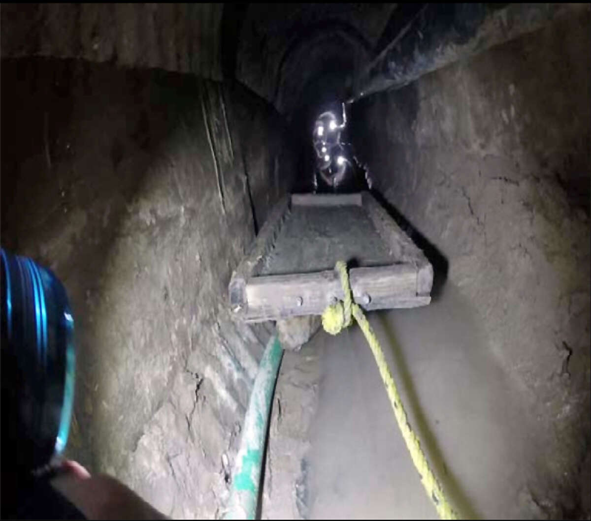 This April 25, 2015 photo, from the U.S. Border Patrol and introduced as evidence in U.S. District Court, shows a trolley in the Mexican side of a tunnel that Border Patrol agents said was used by Evelio Padilla. a Honduran national, to smuggle over 50 pounds of cocaine into the U.S. Padilla pleaded guilty Wednesday, Aug. 19, in federal court in San Diego to one count of possession of drugs with intent to distribute. (U.S. Border Patrol via AP)
