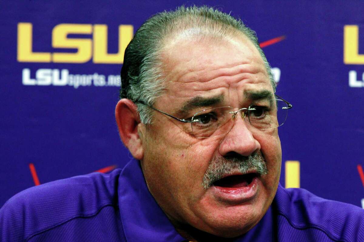 In this Aug. 7, 2012, file photo, then-LSU defensive coordinator John Chavis talks to reporters during their NCAA college football media day in Baton Rouge, La. The SEC will have 14 new coordinators this season. In typical SEC style, some have been spare-no-expense hires. Defensive coordinators Will Muschamp of Auburn and John Chavis of Texas A&M are each making at least $5 million over the next three years at their new jobs.