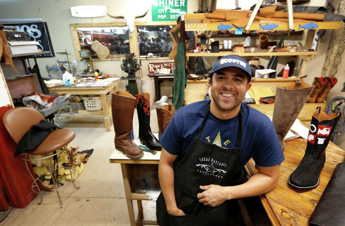 Jason Gawlik makes custom cowboy boots the old-fashioned way, even though he's a young guy. Gawlik posed for a portrait Tuesday, Aug. 18, 2015, in Houston. Some of his equipment is more than 100 years old. He works in the back of Texas National Outfitters, 8933 Katy Freeway. ( Steve Gonzales / Houston Chronicle )
