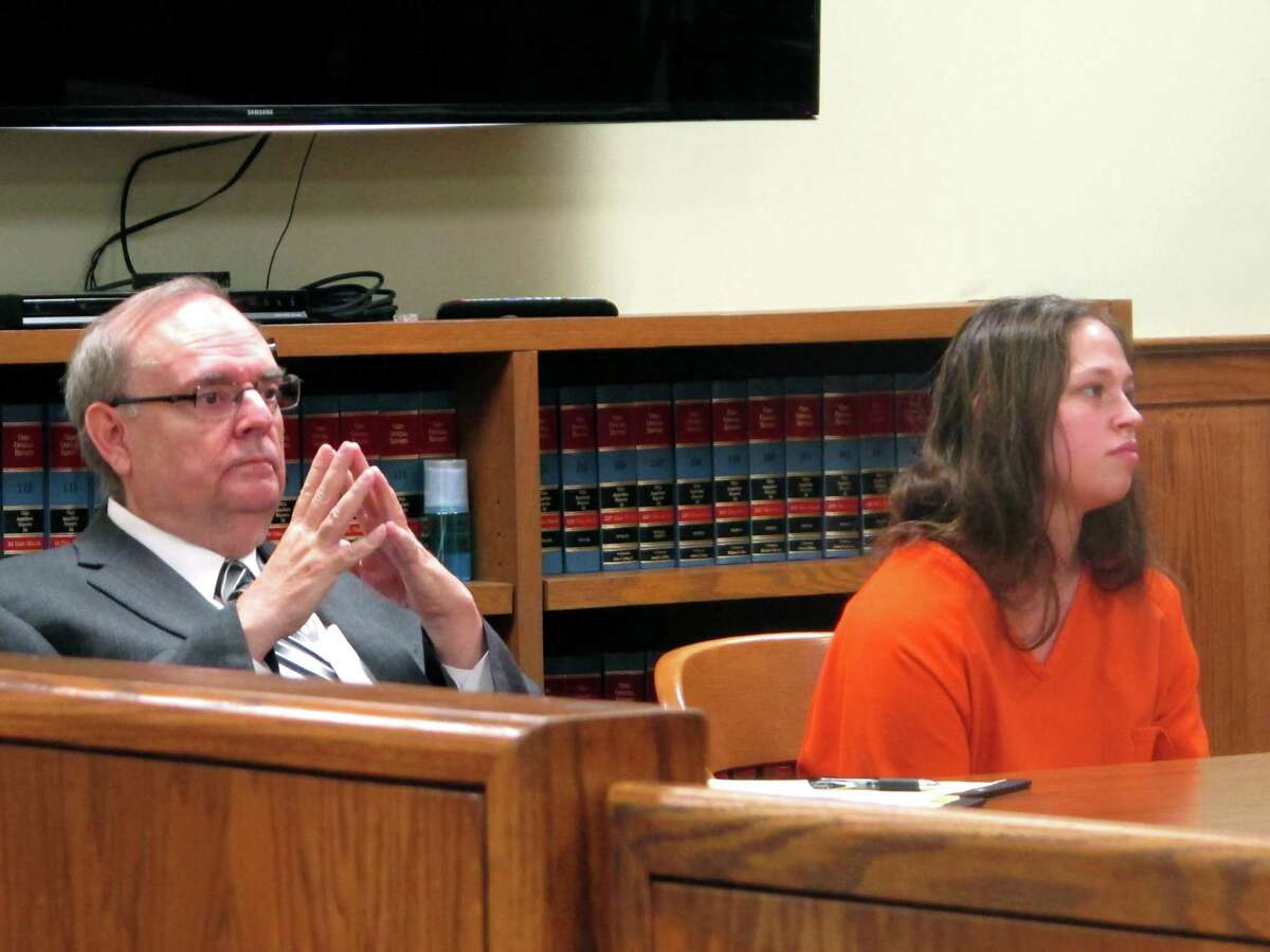 Brittany Pilkington, with her attorney Marc Triplett, listens as a judge sets her bail. Pilkington is accused of suffocating each of her three sons in April 2014, July 2014 and this week.