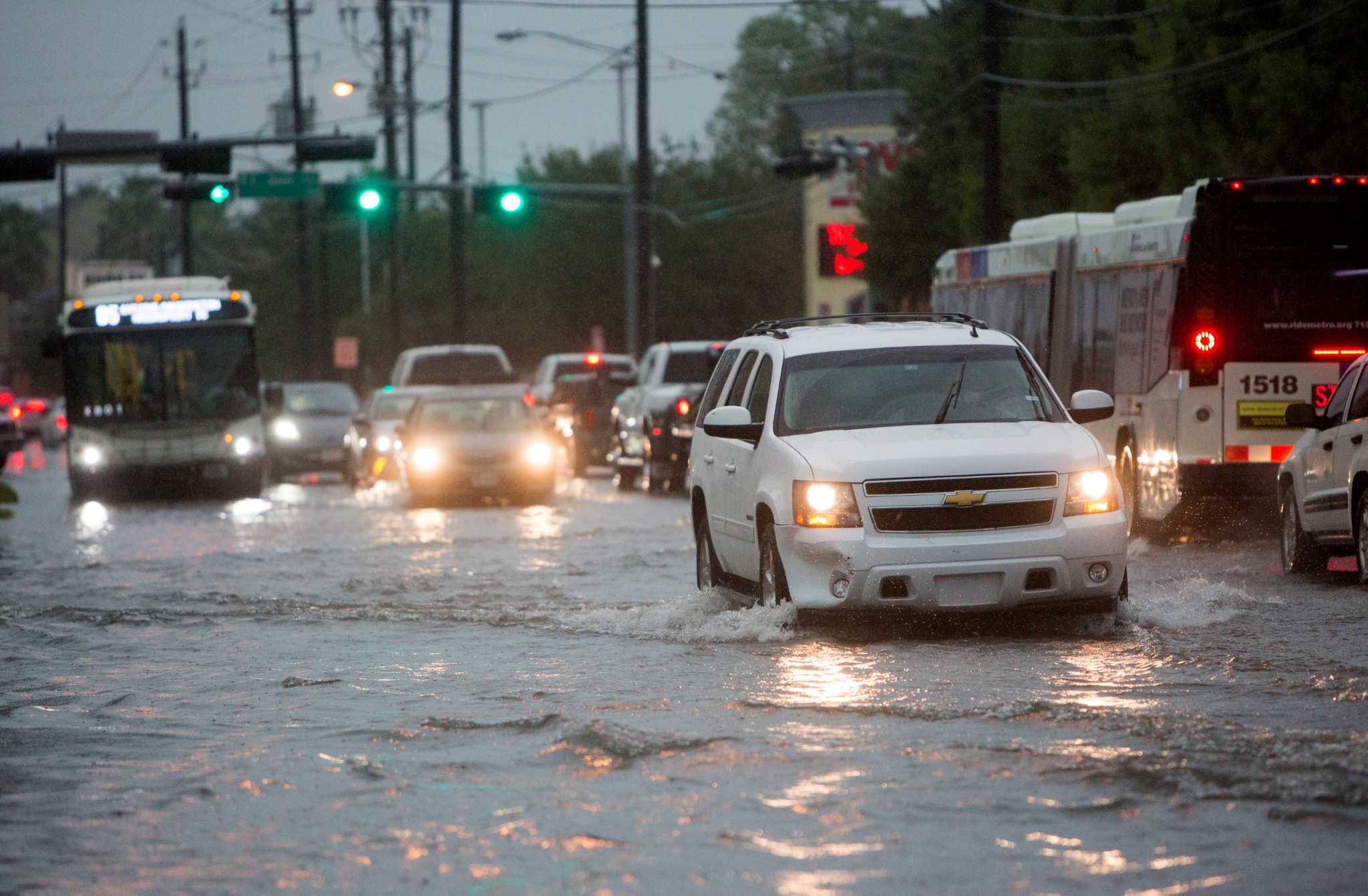 Storms spark fires, flood streets