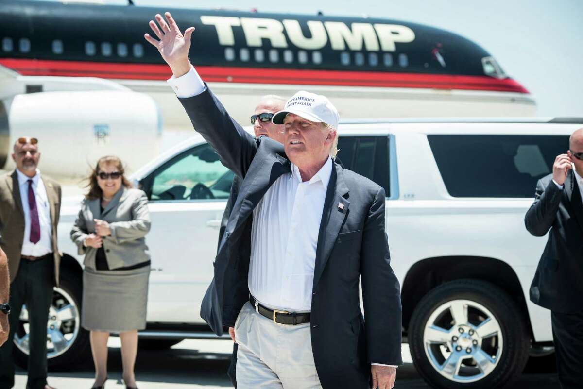 Republican Presidential candidate and business mogul Donald Trump exits his plane during his trip to the border on July 23, 2015 in Laredo, Texas.