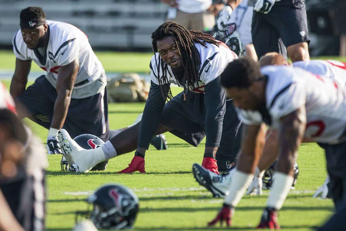 The Texans are taking things slow with linebacker Jadeveon Clowney, center, as he works to get back into playing shape after knee surgery last season.