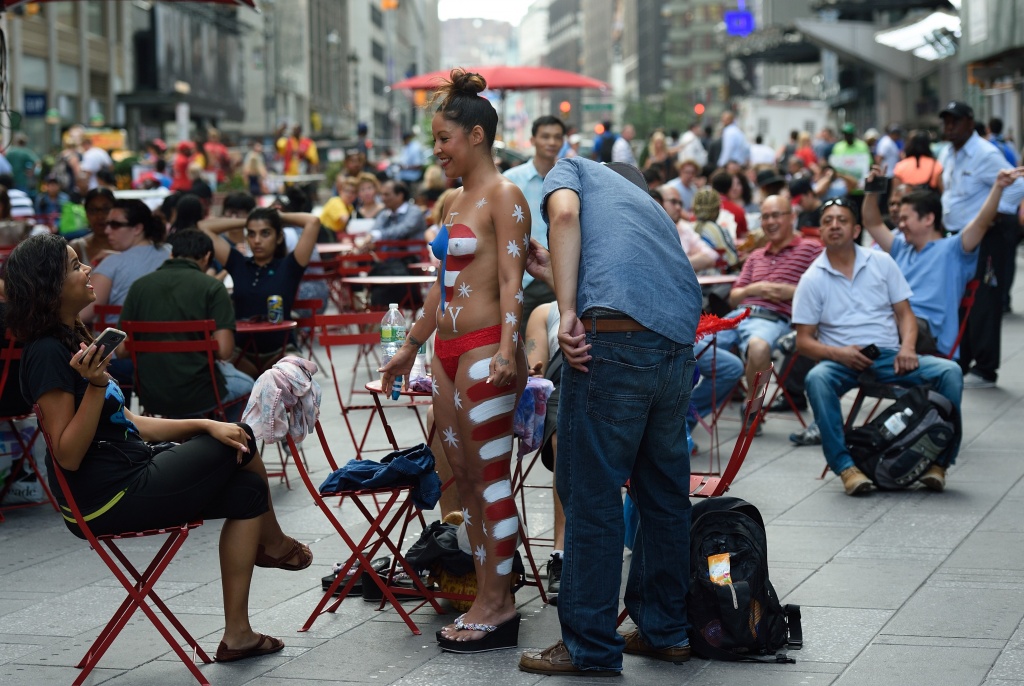 The Desnudas are topless women wearing only panties who paint their exposed  bodies with body paint and stand in Times Square to pose with tourists fo  Stock Photo - Alamy