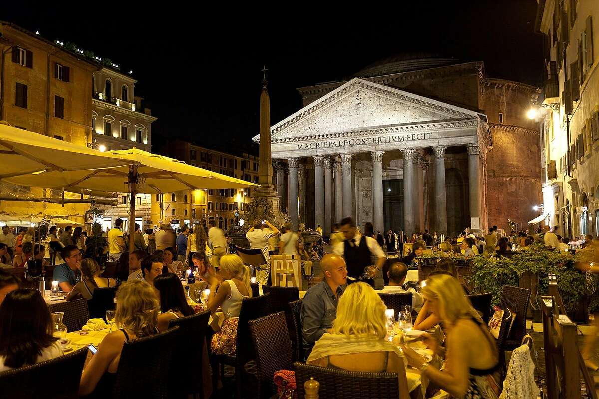 Ancient monuments, such as the floodlit facade of Pantheon, become part of the social scene in Rome at night. az110706rm-1369.jpg