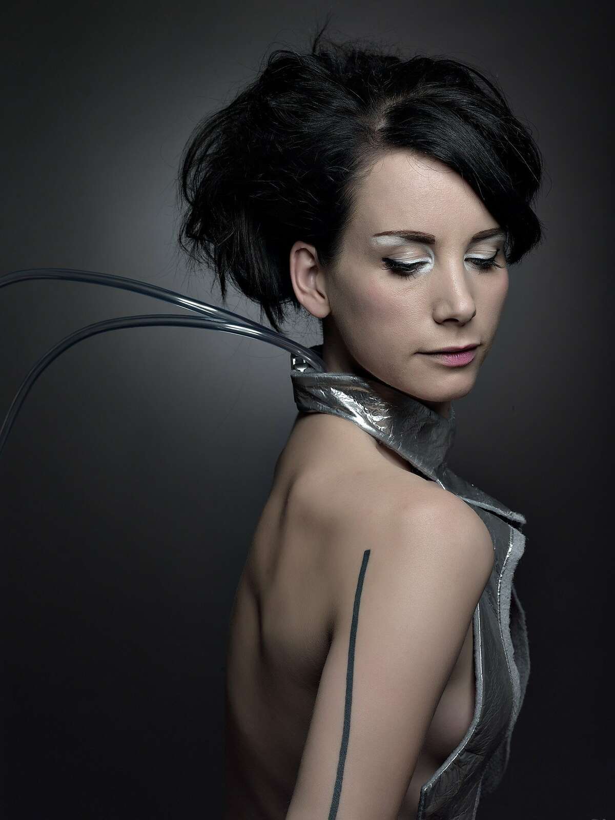 Dutch fashion designer Anouk Wipprecht, pictured here, is known for mixing technology into her apparel to make clothing that responds to the wearer's vital signs, such as blowing smoke when another person comes too close or making spider-like tentacles flare out to ward off someone intruding into the wearer's space. Her "Spider Dress" is on display at the Museum of Craft and Design through Sept. 13, 2015, in an exhibit of futuristic interior, architectural and fashion design by Dutch designers.