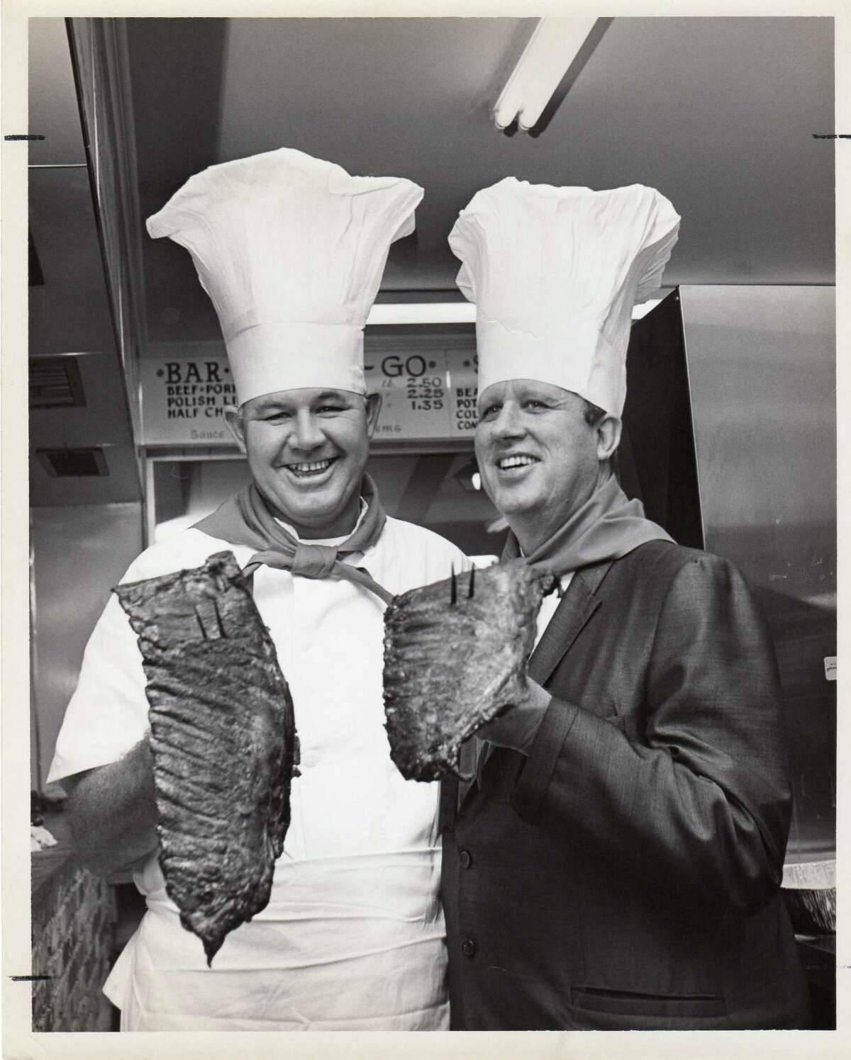 Above, Leonard McNeill at a Lenox Bar-B-Q catering job during the 1970s. Left, Leonard McNeill, left, and Lloyd Smallwood at the Longhorn Barbecue on Gessner, circa mid-1960s.