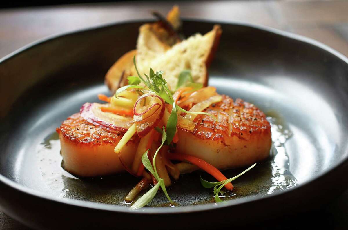 Vietnamese-style Scallops; Scallops with Vietnamese slaw and nuoc mam at Izakaya, 318 Gray, at the corner of Gray and Bagby, on Thursday, July 23, 2015, in Houston. ( Karen Warren / Houston Chronicle )