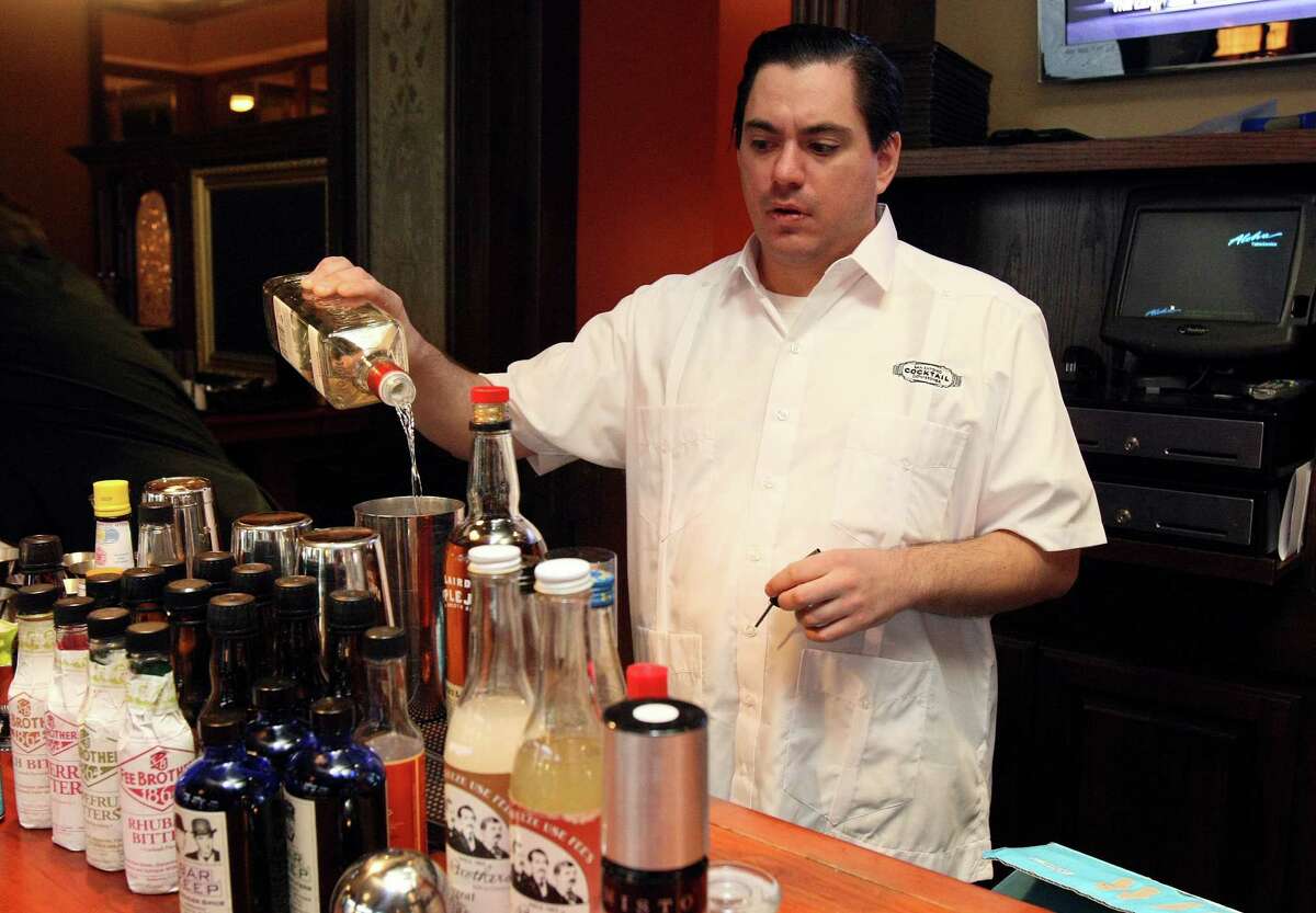 In this photo from 2012, the first year of the San Antonio Cocktail Conference, Sasha Petraske mixes a cocktail at Bohanan's. Petraske, whose unapologetic dedication to expertly made pre-Prohibition drinks made Milk & Honey a central phenomenon in the modern cocktail revival, died on Aug. 21, 2015, at age 42.