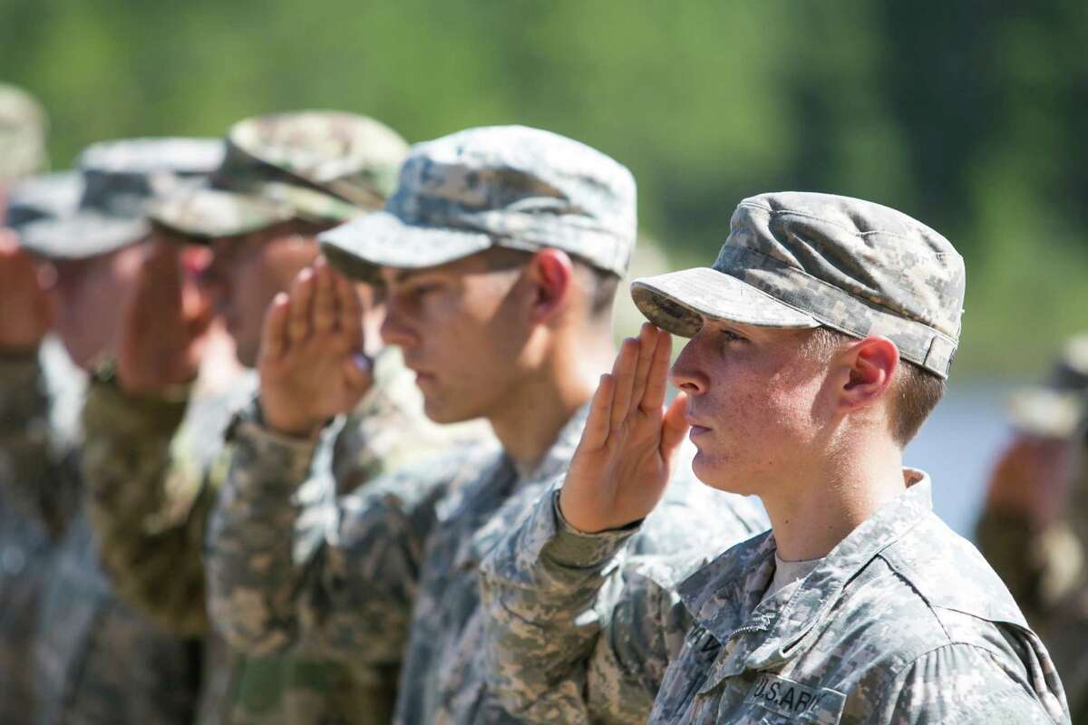FORT BENNING, GA - AUGUST 21: First Lt. Shaye Haver (R) salutes during the graduation ceremony of the United States Army's Ranger School on August 21, 2015 at Fort Benning, Georgia . Griest and Haver are the first women ever to successfully complete the U.S. Army's Ranger School. (Photo by Jessica McGowan/Getty Images)