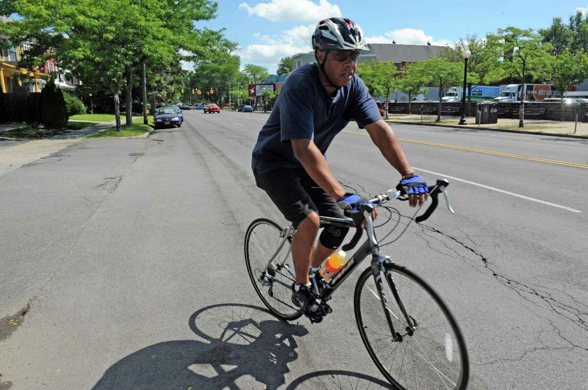 Don Kendricks of Albany bicycle on Madison Avenue on Friday Aug. 21, 2015 in Albany, N.Y. (Michael P. Farrell/Times Union)
