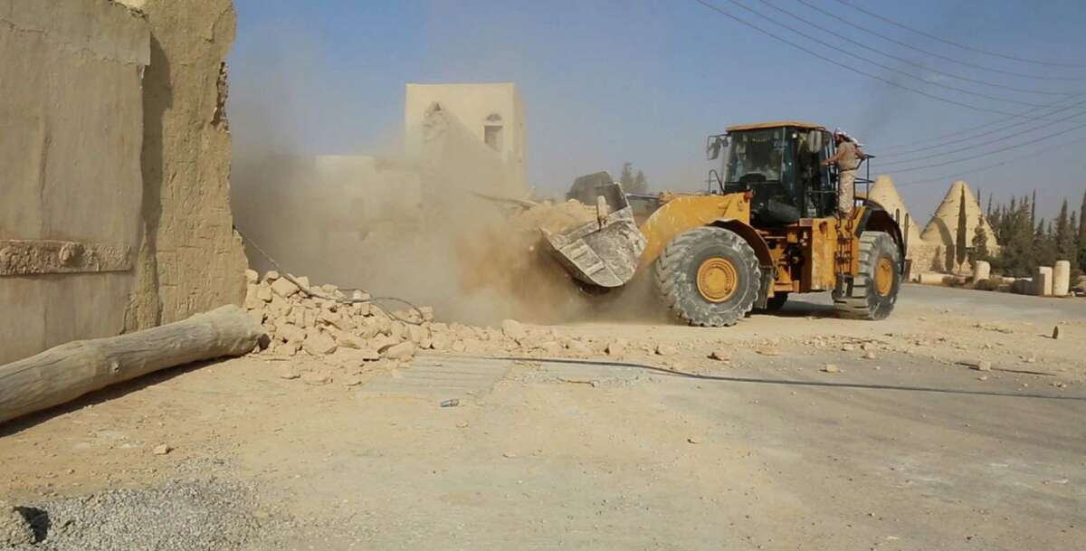 This picture, released late Thursday﻿ by an Islamic State militant-affiliated website, shows a bulldozer destroying the Saint Eliane Monastery near the town of Qaryatain, Syria. The town, located in Homs province, was captured by Islamic State militants in early August. ﻿