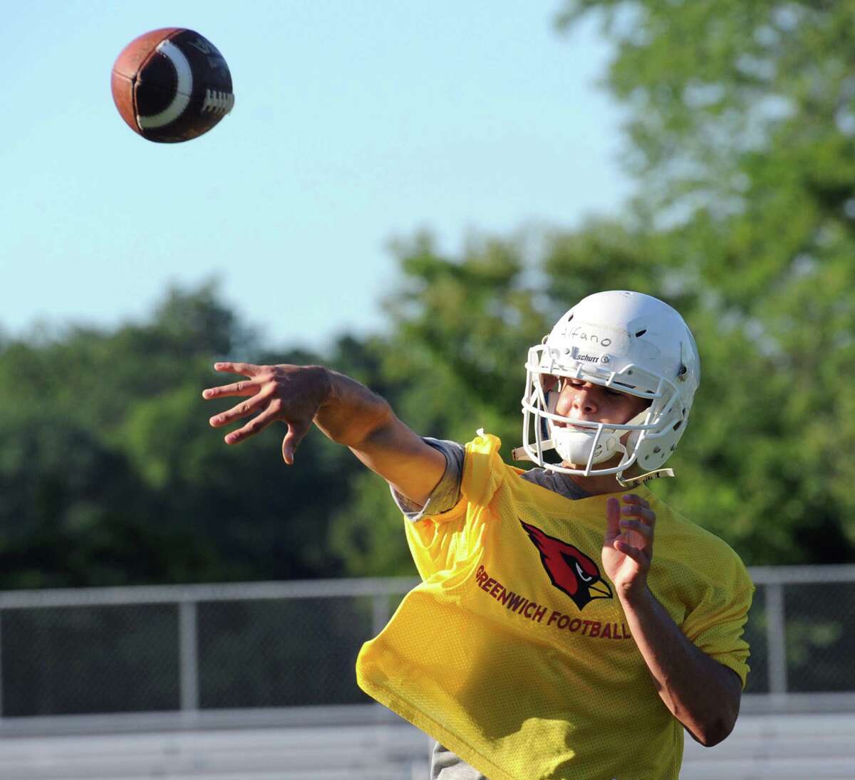 Quarterback Frank Alfano throws during the first day of Greenwich High School football practice at the school in Greenwich, Conn., Friday, Aug. 21, 2015.