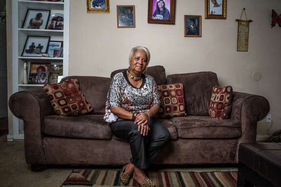 Reinita Jackson poses for a portrait in her home Thursday August 20, 2015. Jackson moved to Houston from New Orleans after being trapped in her home in neck-deep water for 5 days during Hurricane Katrina.